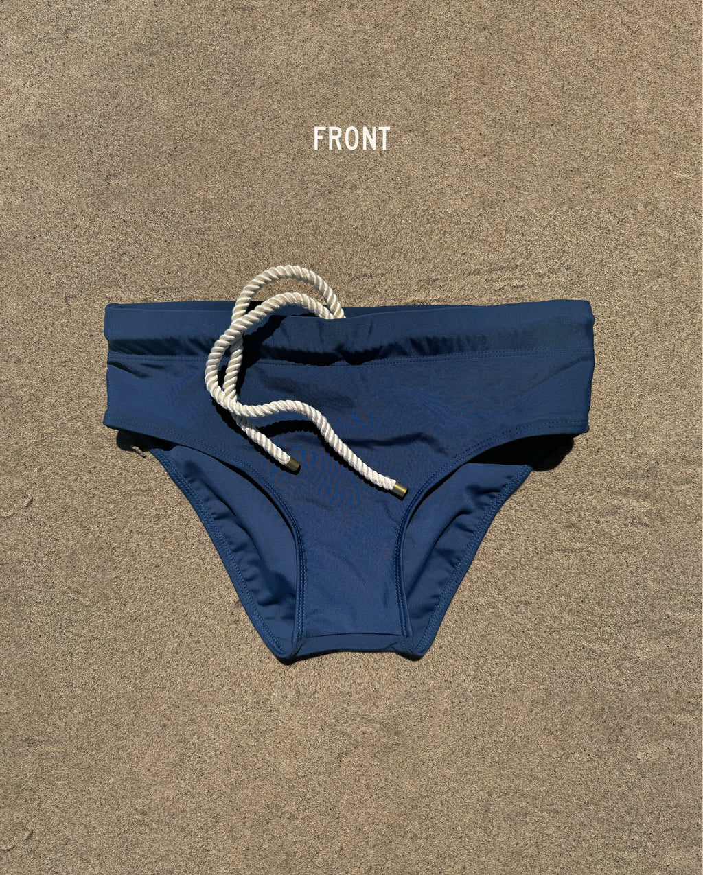 Front view of navy Lobby’s Nippers swim briefs, featuring a white rope drawstring and classic brief silhouette.