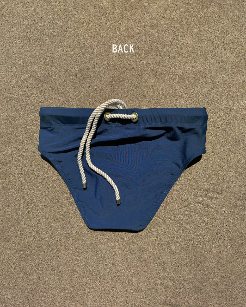 Back view of navy Lobby’s Nippers swim briefs, featuring the signature white rope detail at the waistband.