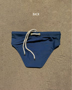 Back view of navy Lobby’s Nippers swim briefs, featuring the signature white rope detail at the waistband.