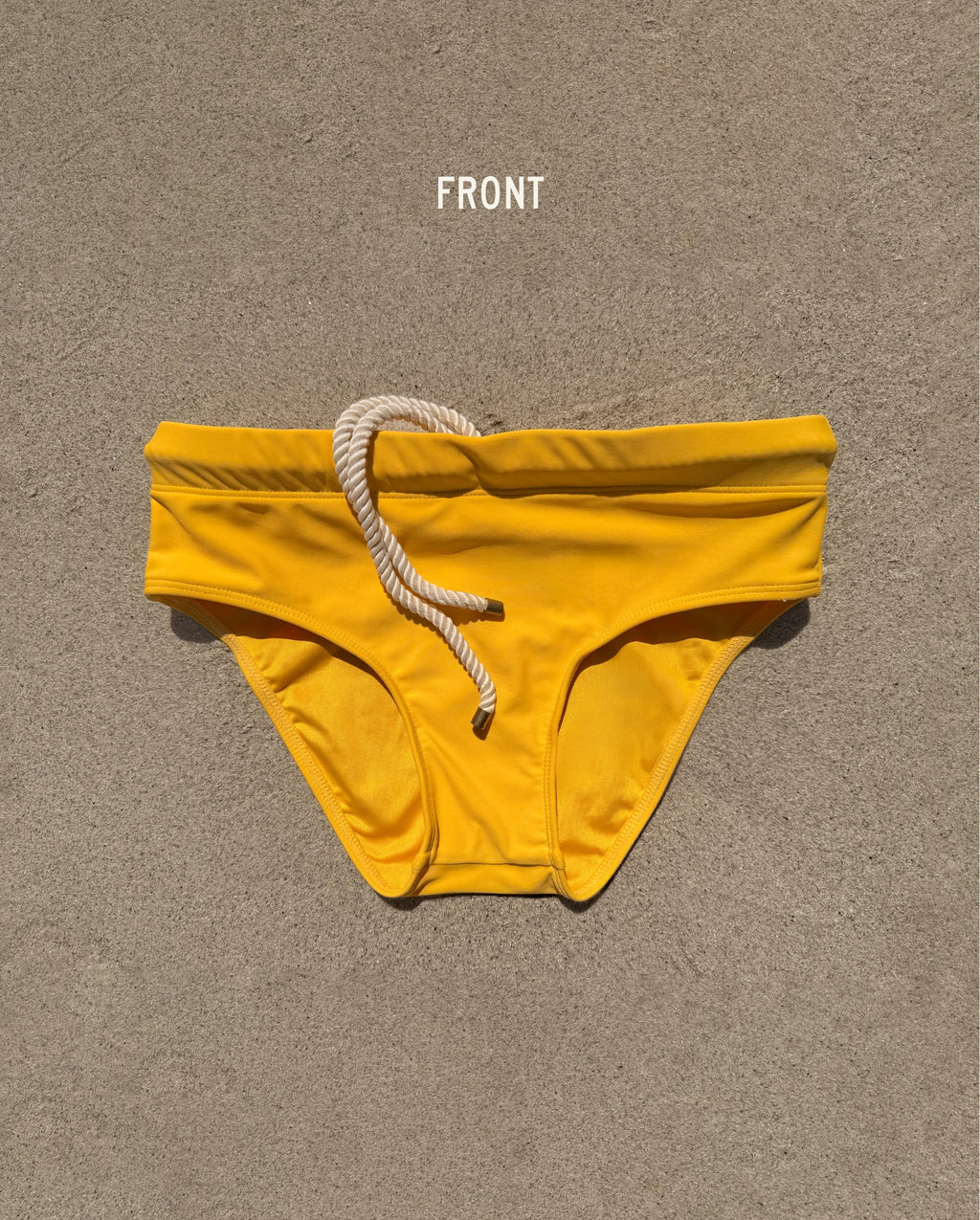 Front view of yellow Lobby’s Nippers swim briefs, featuring a white rope drawstring and classic brief silhouette.