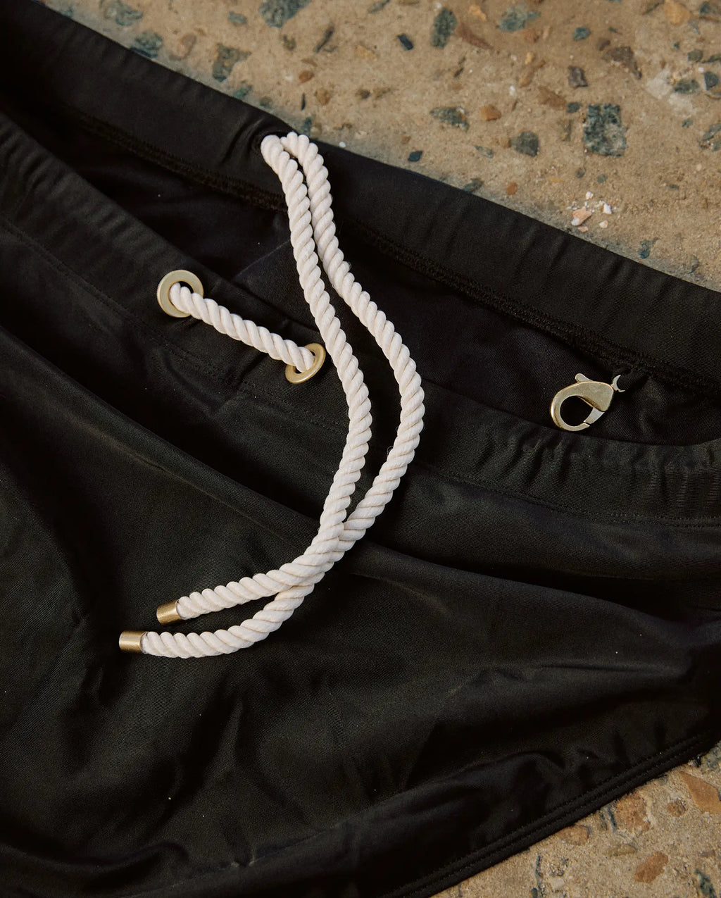 Lobby’s black swim briefs – premium stitching and fabric details.