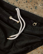 Lobby’s black swim briefs – premium stitching and fabric details.