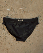 Lobby’s black swim briefs – refined and elegant swimwear, back view