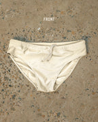 White Lobby’s one-piece swimwear, front view, minimalist design with refined silhouette on neutral background.