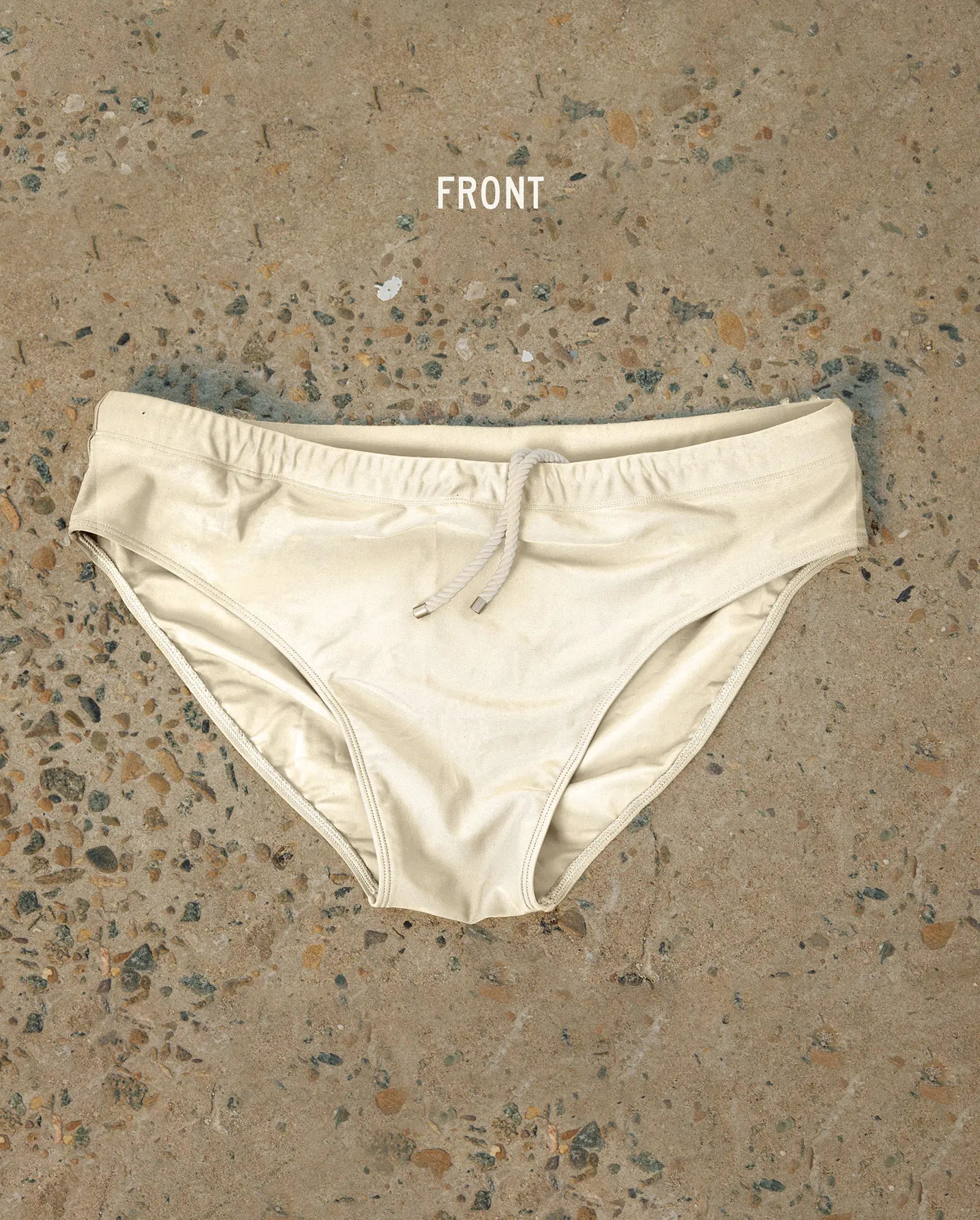 White Lobby’s one-piece swimwear, front view, minimalist design with refined silhouette on neutral background.