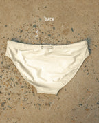 Back view of white Lobby’s swimwear, featuring a clean open-back cut and elegant proportions.